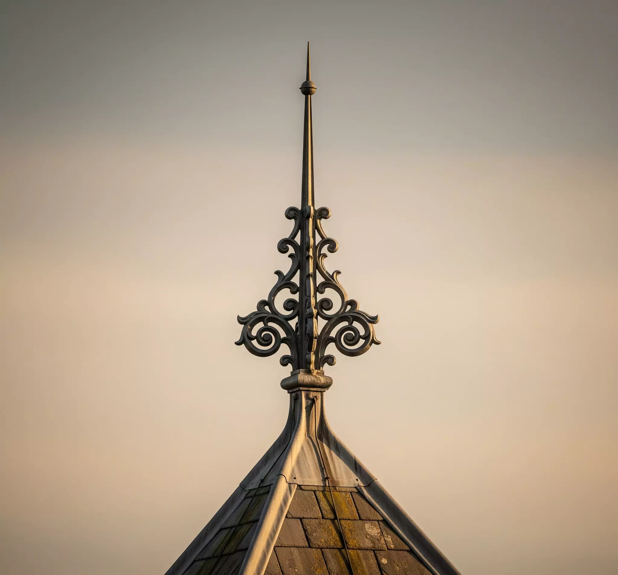 A decorative finial on a roof peak