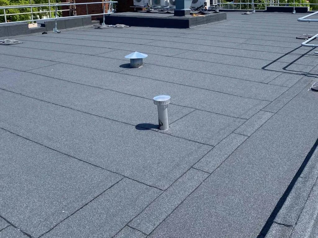 A commercial building with a new flat roof system
