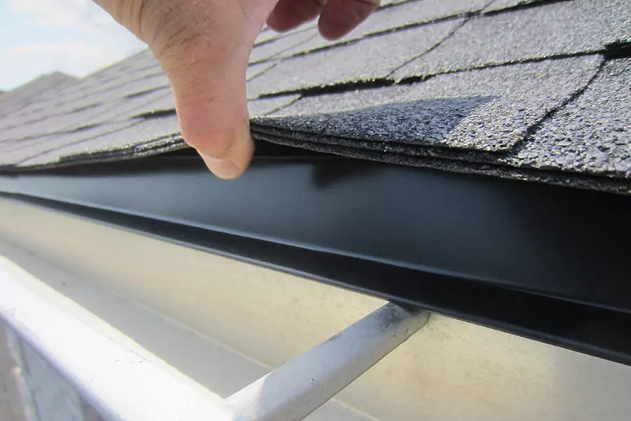 Drip edge installed at the eave of a new shingle roof on a Queens home, ready for the gutter