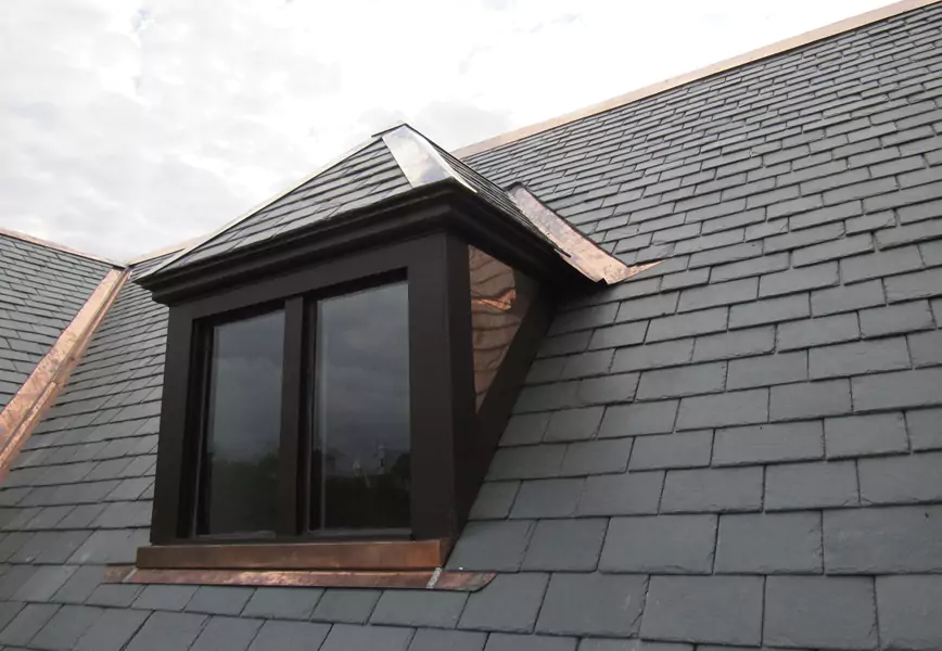 A modern home with a beautiful natural slate roof