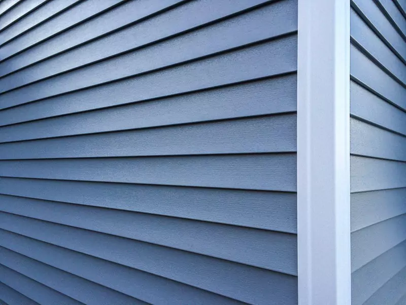 Close-up of cheap vinyl siding on a house