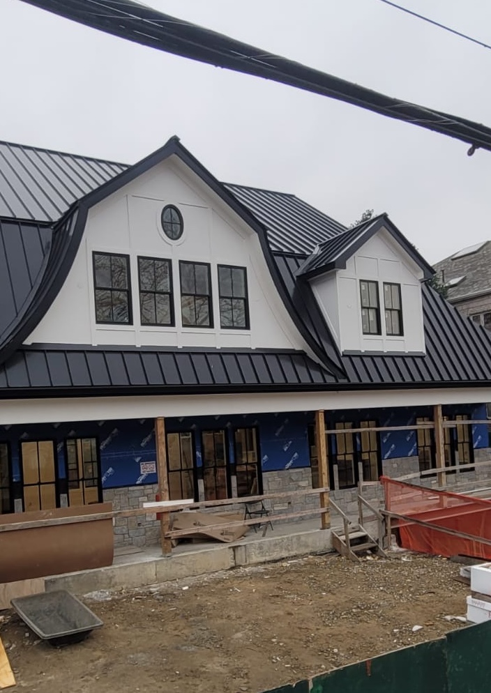 new standing seam metal roof being installed in queens, NY